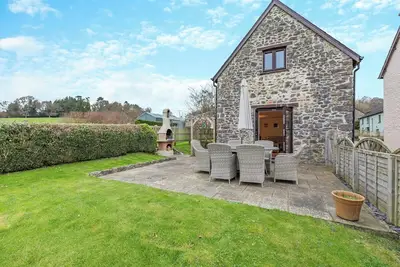 Image de Woodpecker Barn is a charming three-bedroom holiday home in Ipplepen, sleeping up to seven guests.