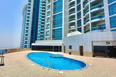 Image de Luxury Home seafront view 1bhk pool gym wifi
