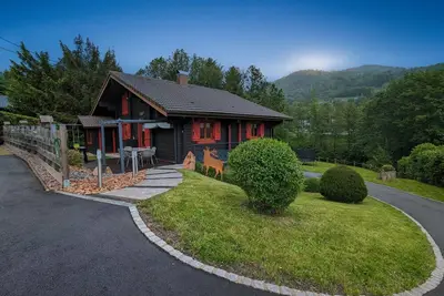 Image de Le Chalet \" Les Volets Rouges \"\nChalet tout confort, proche de La Bresse