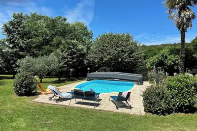 Image de Gite Le Ruisseau Du Bejean avec piscine et parc arboré