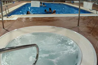 Image de Cozy apartment with spa, saunas, gym, paddle tennis, golf, wifi