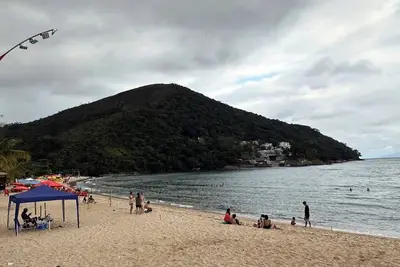 Image de Casa espaçosa com churrasq e Wi-Fi a 400m da praia