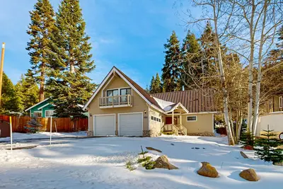 Cozy home with spacious deck, open floor plan, fireplace, nearby activities