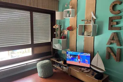 Image de T3 de 59m2 avec une jolie décoration vintage et une terrasse extérieure