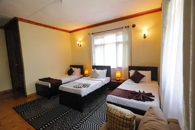 Image de 6-bedroom lodge in charming Arusha with Ac, WiFi. Enjoy a cozy stay