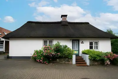 Image de Maison de vacances 'Stine's Hus' avec terrasse privée, jardin privé et Wi-Fi