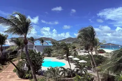 Image de Allamanda 104, appartement cosy en 1ère ligne sur la Plage de la  Baie Orientale!