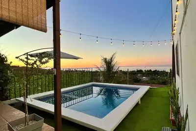Image de house with a beautiful sea view in enchanting SurfCity with WiFi, Ac and Pool.