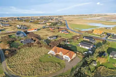Family-friendly holiday home with pool, located close to the North Sea in Vrist.