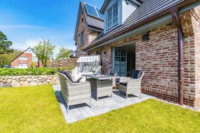 Image de Relax and feel good in the vacation home Marit - half of the house with garden and sauna.