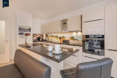 Image de Ferienwohnung Lieblingsort - Modern beach apartment with balcony & 2 bathrooms