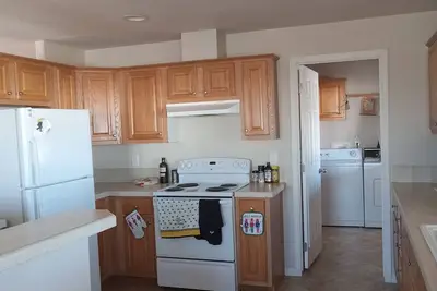 Image de Master suite with private bathroom, as well as shared, living, kitchen, WiFi