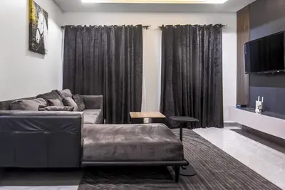 Image de Centrally located cozy 2 Bdr apartment 3mins to Wuse 2!