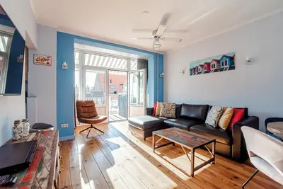 Luxe apartments with large terrace. Within 1 minute of the beach!