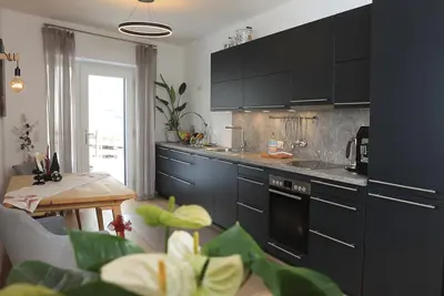 Image de Apartment Valerie enchants with its modern design and harmonious choice of colors.
