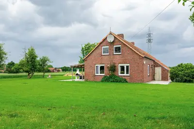 Image de Maison de vacances 'Ferienhaus Lüttje Dörp' avec terrasse privée, jardin privé et Wi-Fi