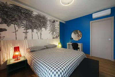 Image de Chambre d'hôtes 'Camera Matrimoniale Deluxe Two' avec terrasse partagée, Wi-Fi et climatisation