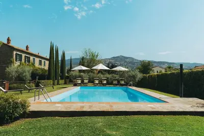 Image de Séjour à la ferme à Cortona avec piscine partagée