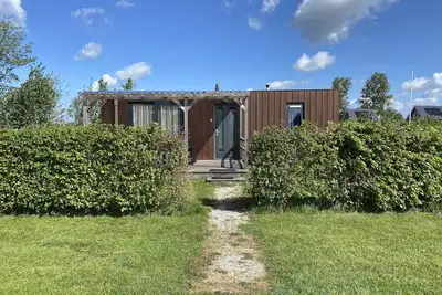 Image de Chalet confortable pour 4 personnes dans la nature frisonne