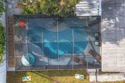 Image de New - Mermaid Paradise - Tropical 3br Pool Home with amenities near Gulf Beaches