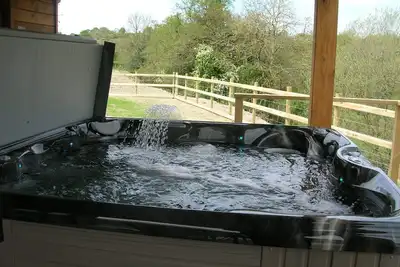Image de River Lodge 5 star Lodge sleeps 6 in 3 king bedrooms with Hot Tub under cover.