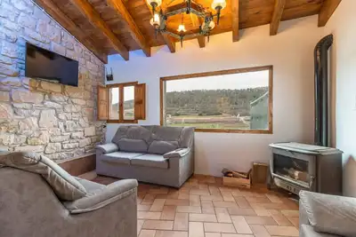 Image de Maison de vacances 'Casanellas' avec vue sur les montagnes, jardin privé et Wi-Fi