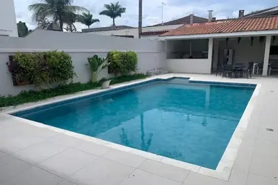 Comfortable house with 4 suites in a luxury condominium in Guaruja