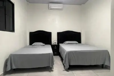 Image de Cozy 1-bedroom apartment with Ac, WiFi, 4 min from the airport of El Salvador