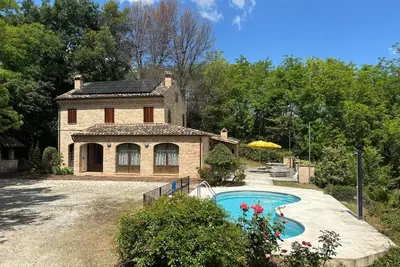 Image de Villa in a historic farmhouse with stunning views from the pool