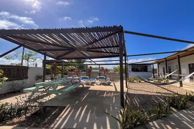 Image de This charming two-bedroom cabana invites you to unwind in a serene escape.