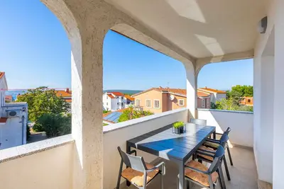 Image de Appartement de vacances avec climatisation et vue sur le jardin