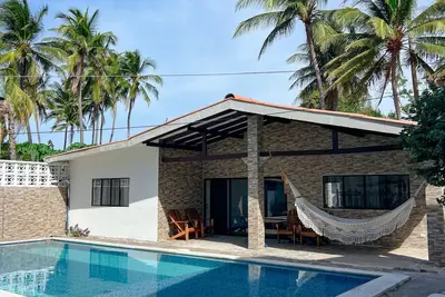 Beautiful modern tropical beach home + pool - steps away from ocean!