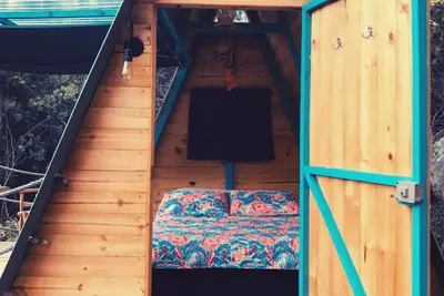 Image de A-Frame cabin in the forest with mountain view