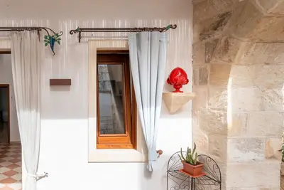 Image de Appartement 'Corte Curatolo - Ciuri' avec terrasse partagée, Wi-Fi et climatisation
