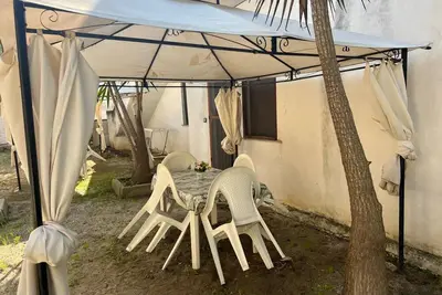 Image de Appartement 'La Quiete - Gazebo Esterno 1' avec piscine partagée, Wi-Fi et climatisation