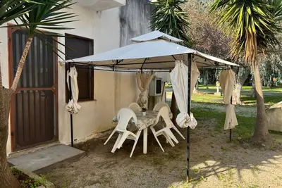 Image de Appartement 'La Quiete - Gazebo Esterno 2' avec piscine partagée, Wi-Fi et climatisation