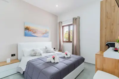 Image de 'Luxury 12 - Chambre Anna' avec Terrasse partagée, Wi-Fi et Climatisation