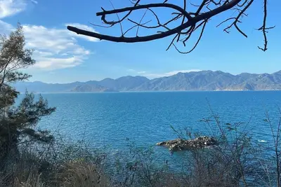 Image de 5 minutes from Beach - Local House with Mountain-view Balcony