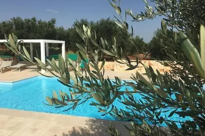 Image de Trullo en Apulie avec Piscine Privée