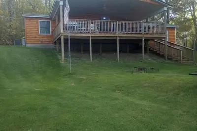 Image de Exclusive lake front property. Nothing but the ritz. Outdoor kitchen & hot tub.