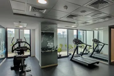 Image de Cozy 1-bed apartment in Jvc Dubai, with pool, Ac, fitness room, WiFi