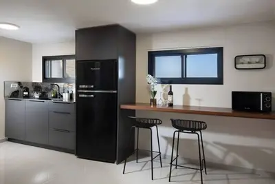 Image de This cozy apartment offers ample space, featuring a comfortable living room perfect for relaxation