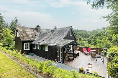 Image de Maison de vacances 'Tannenhäuschen' avec vue sur les montagnes, terrasse privée et Wi-Fi