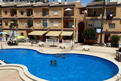 Image de Appartement \"Punta Prima Getaway\" avec piscine partagée, Wi-Fi et climatisation