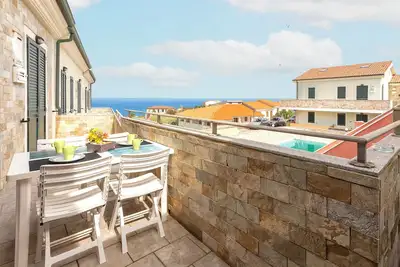 Image de Appartement 'Le Residenze Di Anna' avec vue sur mer, piscine partagée et climatisation