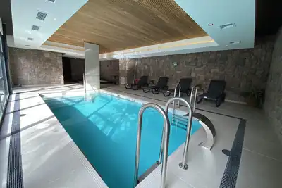 Coastal apartment, steps from the beach. Heated swimming pool, jacuzzi and patio
