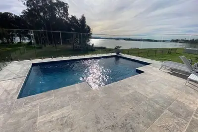 Image de Sunset Lakefront with Private Pool – Your Dream Coastal Oasis!