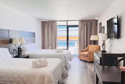 Image de La74 Great studio right on the beach + pool