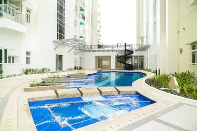 Image de “Jp Solana Staycation – Cozy Studio Near Sm Manila with Pool & Gym Access! ”