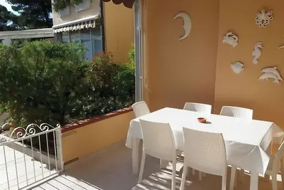 Image de Ferienwohnung 3 Min. zu Fuß zu den Stränden von Capo Bianco und Padulella.